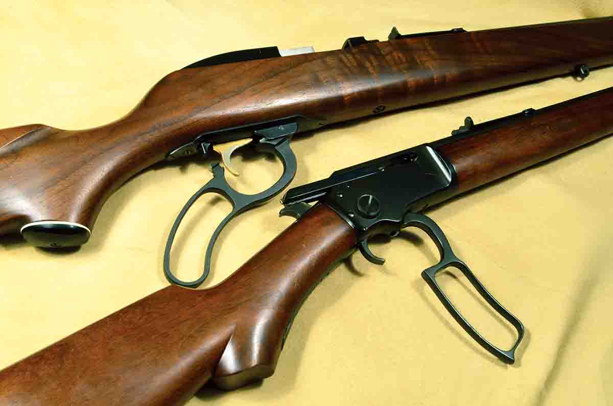 The Model 57 (top) has a very short lever throw compared to the Marlin Model 39. Marlin claimed 2 inches versus 6 inches (25 versus 90 degrees), which allowed the lever to be operated while keeping your hand on the stock and simply flexing your fingers. Whether this advantage was worth the effort is questionable.
